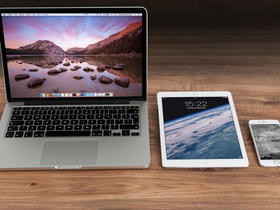 A laptop, tablet and phone side by side on a desk